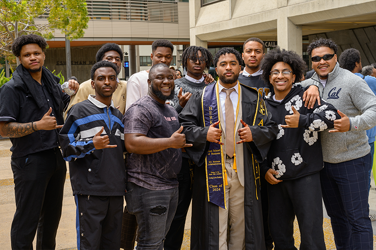 Group of young Black men pose during Black Grad commencement