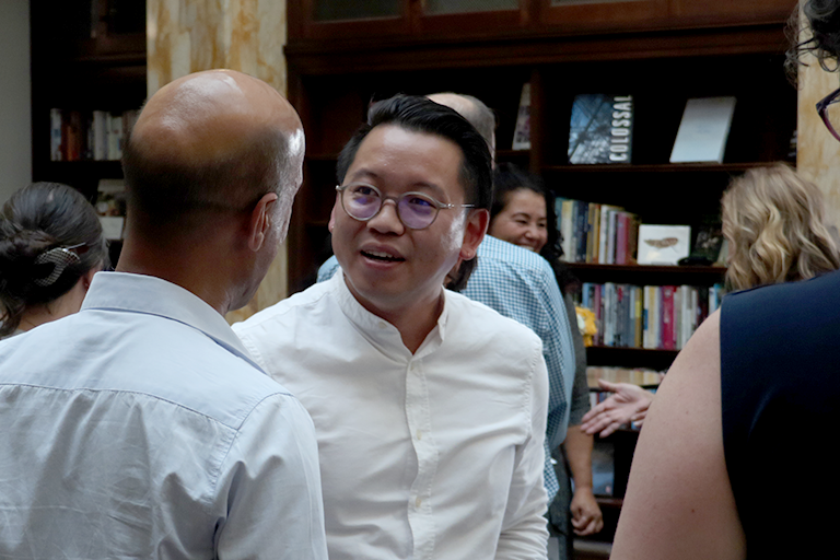 Guests talk at a reception