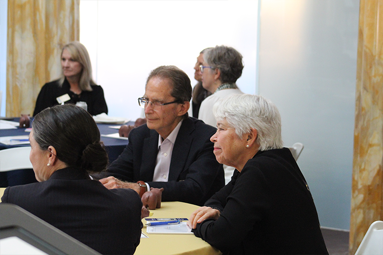 Chancellor Christ and Dean Michael Botchan at a working group table
