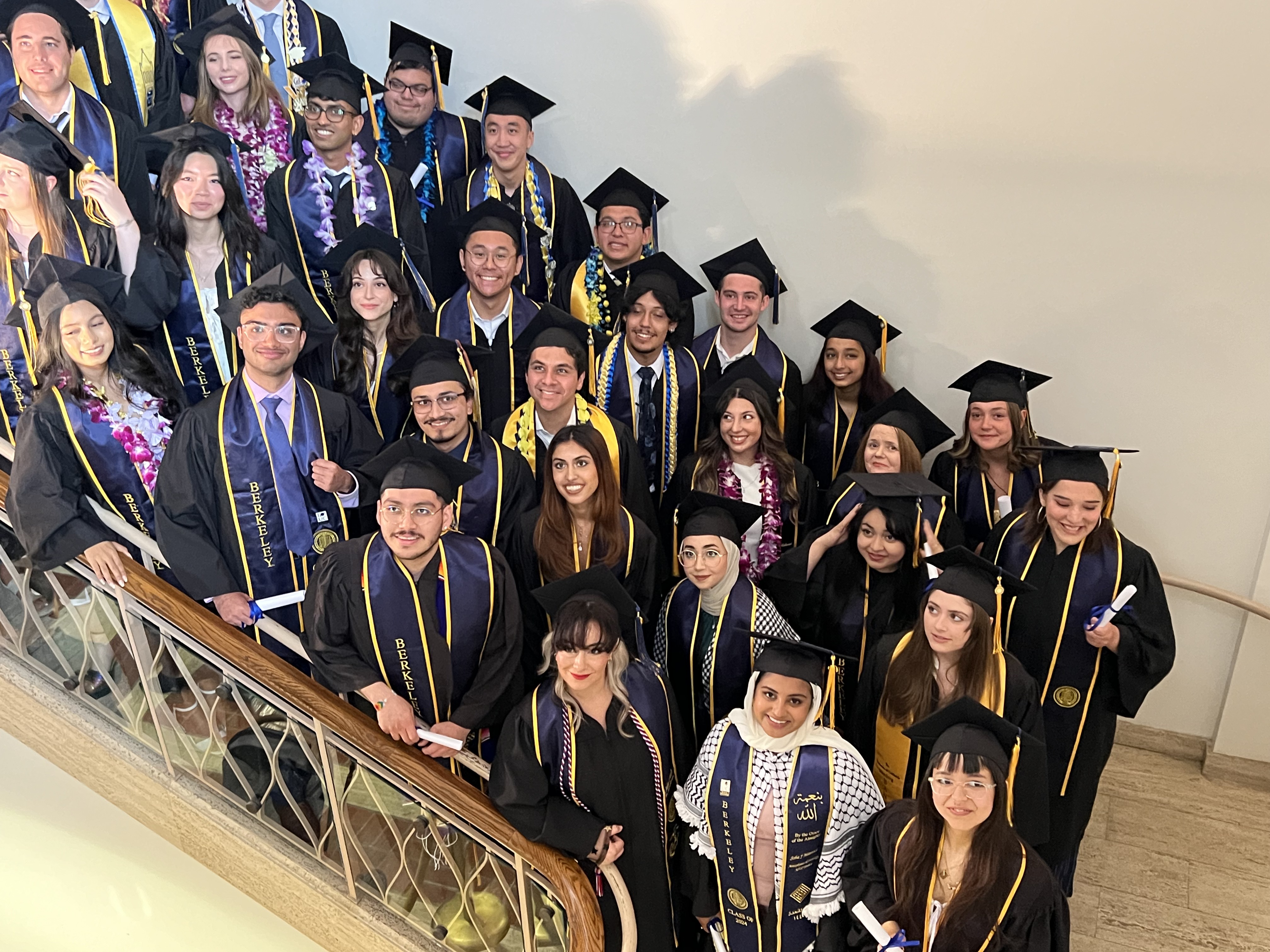 Graduate students standing in stairwell