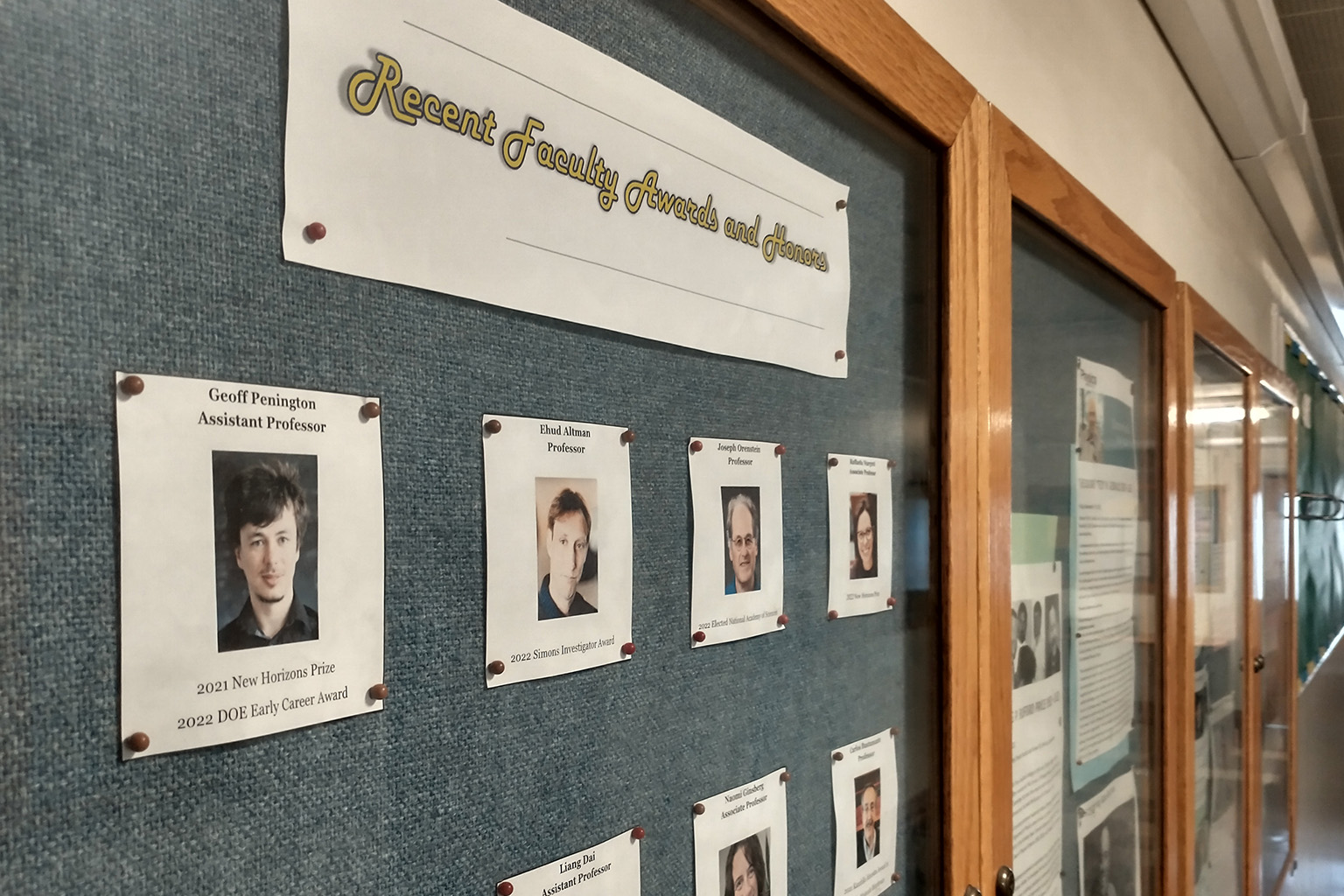 A display case in Physics North displays recent awards won by faculty members.