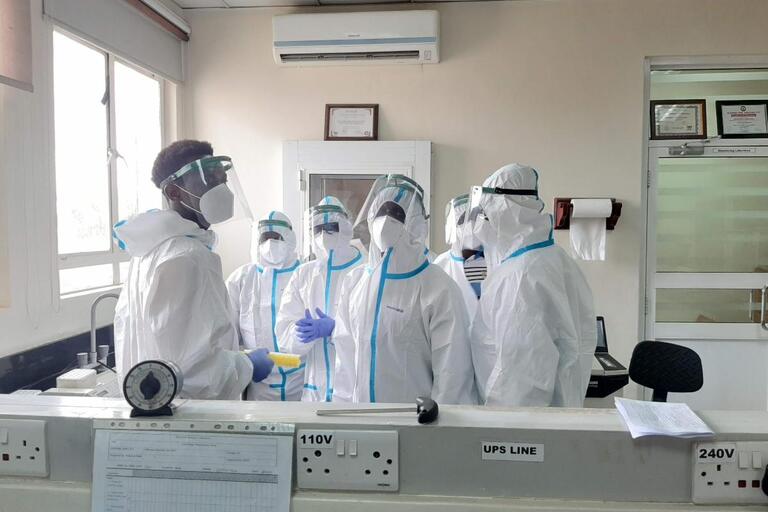 Makerere University scientists and frontline workers wearing PPE
