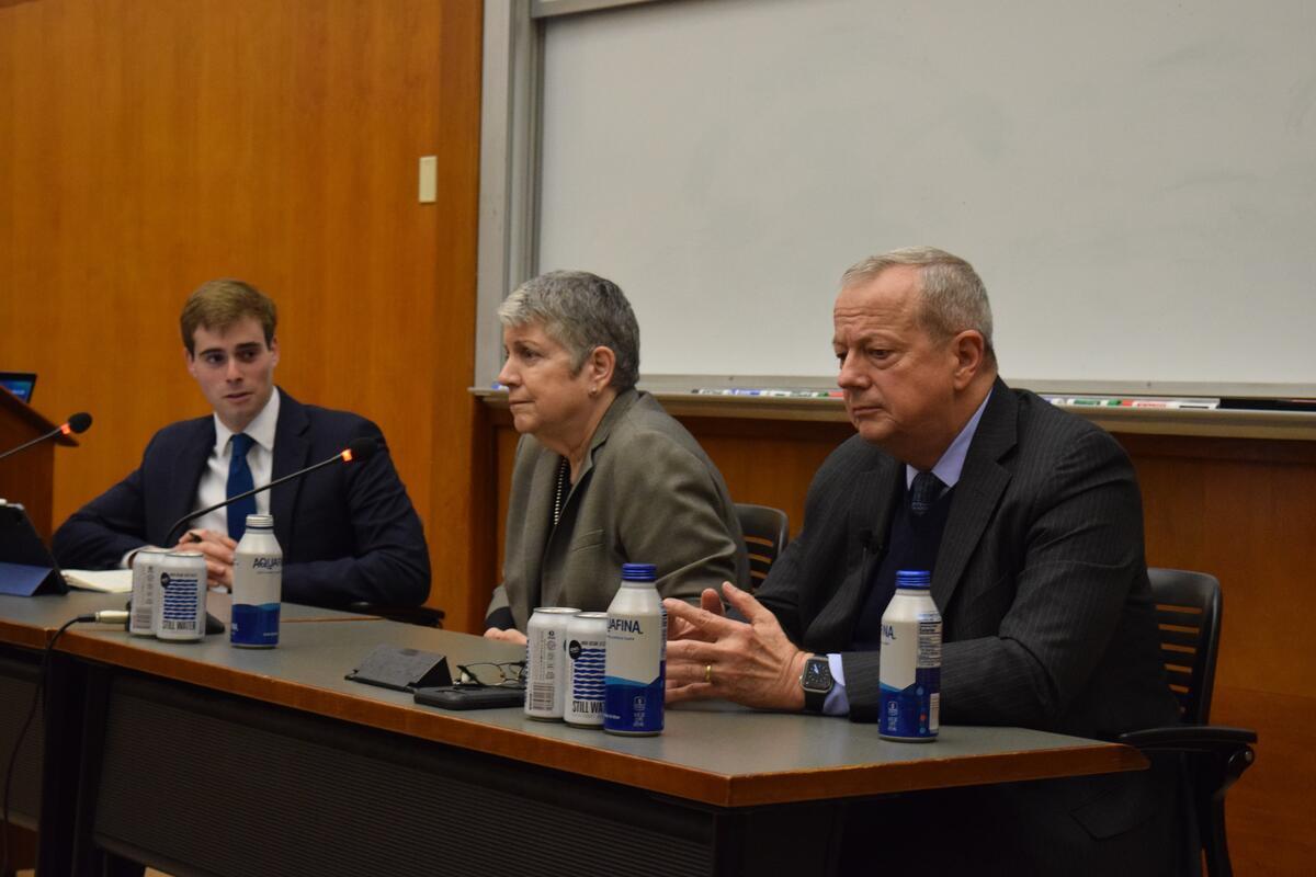 Eli Glickman participates in a panel discussion with two other speakers.