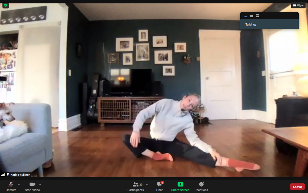 Screen grab of dance instructor stretching on Zoom