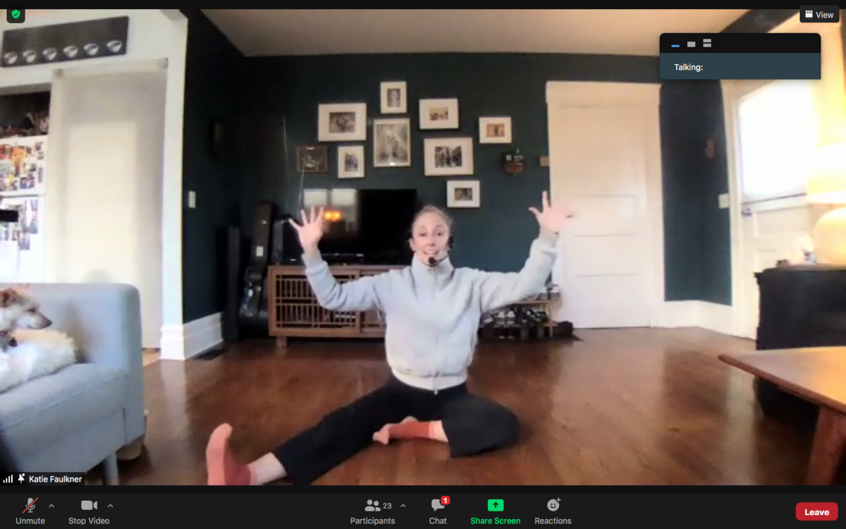 Screen grab of dance instructor stretching on Zoom