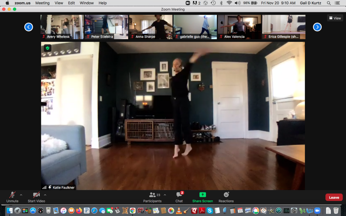 Screen grab of dance instructor in motion on Zoom, with class attendees along the top of the screen