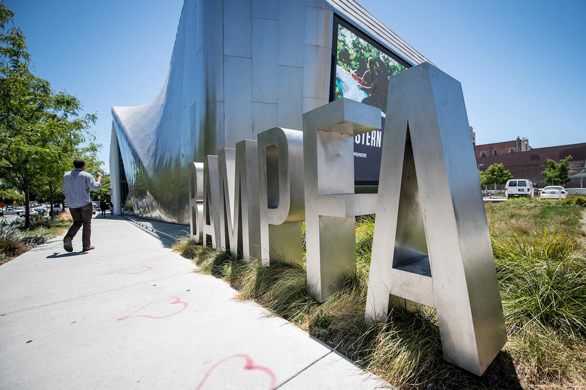 Giant letters spelling out BAMPFA are installed in front of the building.