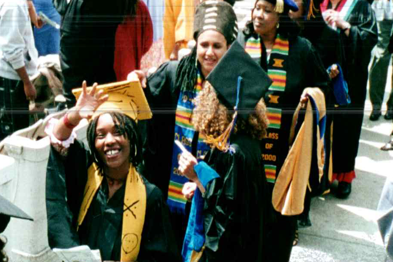 Historical image of students waving during Black Graduation processional