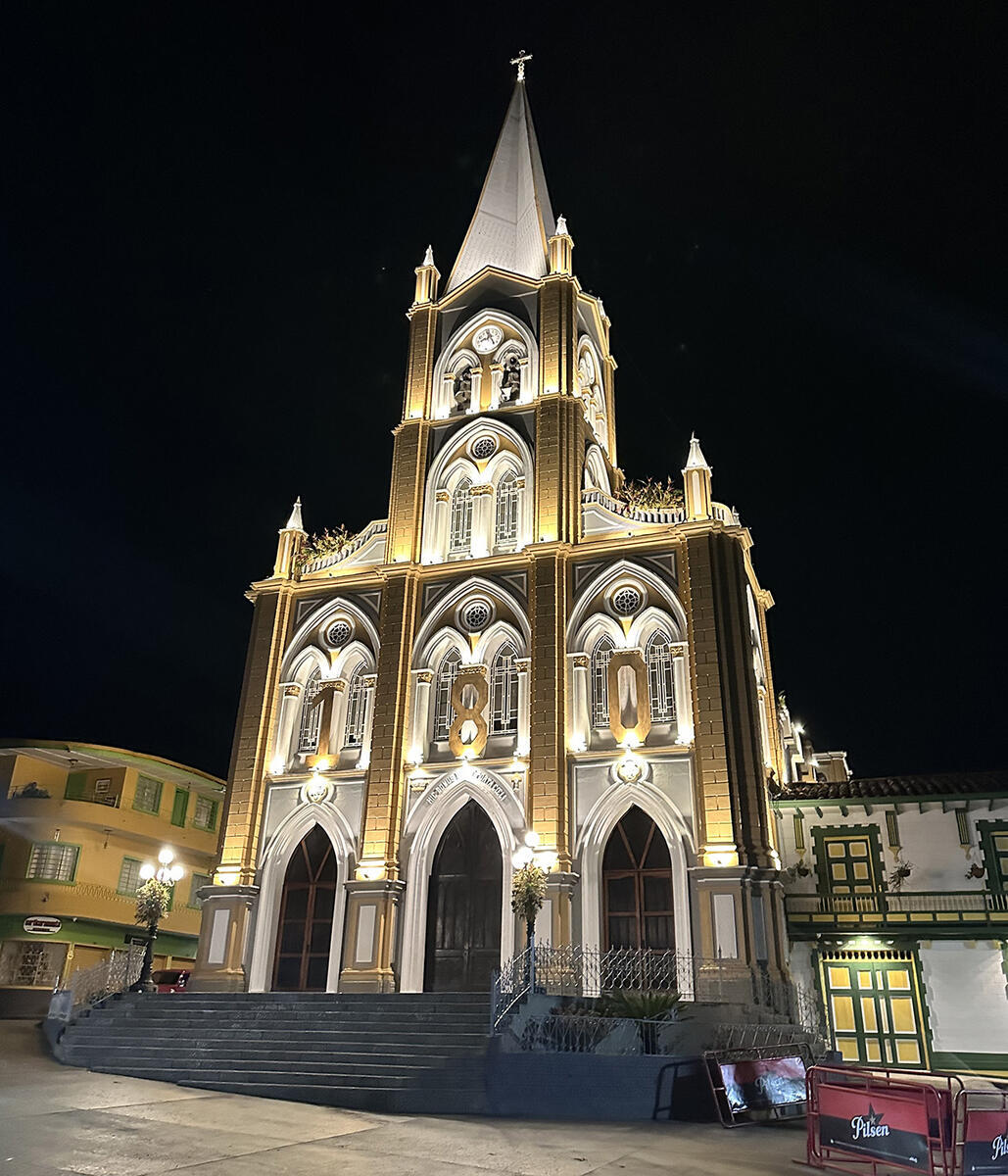 A tall, dramatically lit church at night