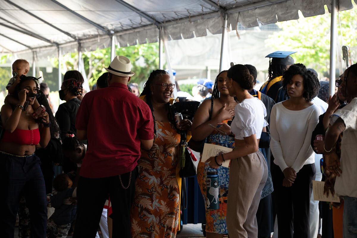 Family and friends crowded together while waiting for the commencement to begin