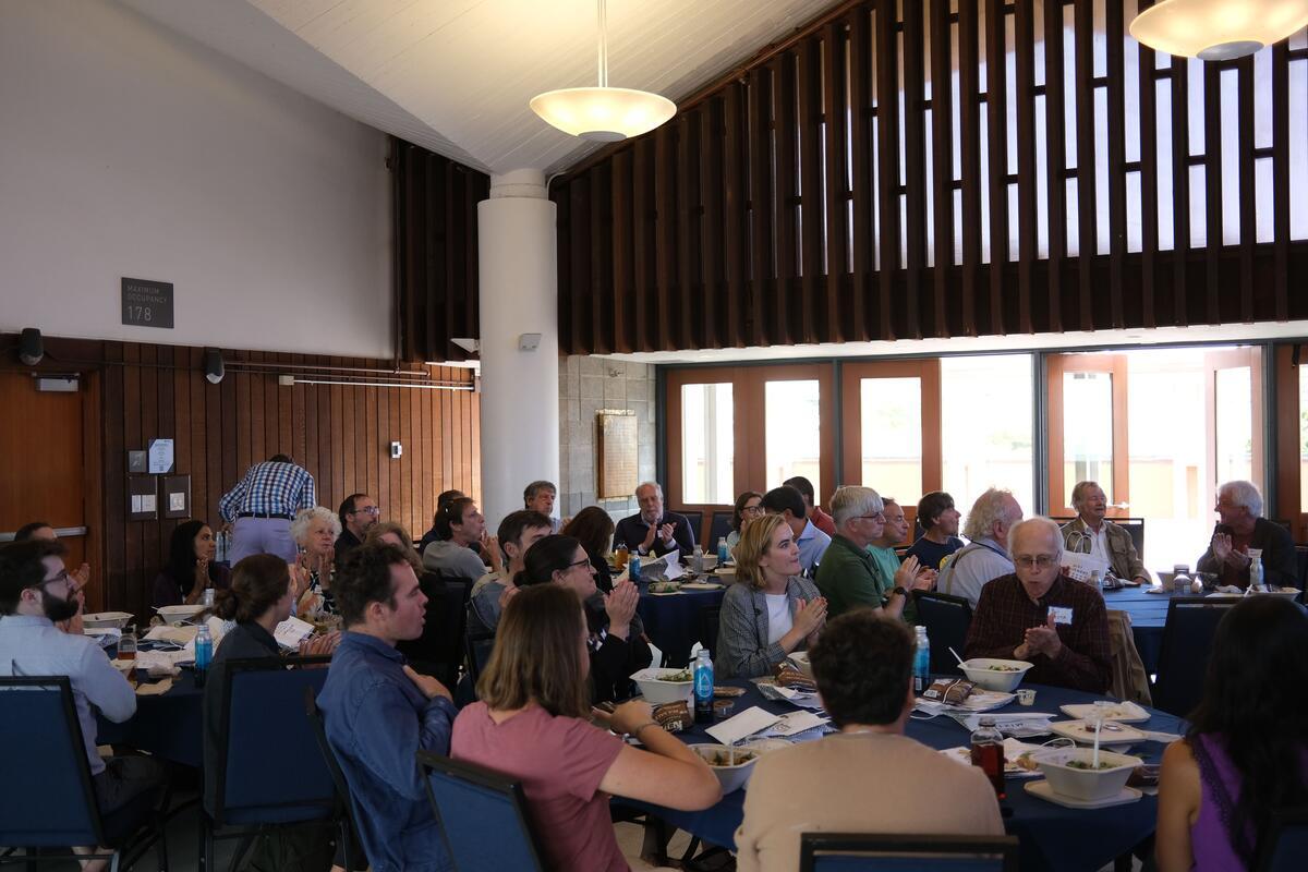 Faculty Forum attendees applaud.