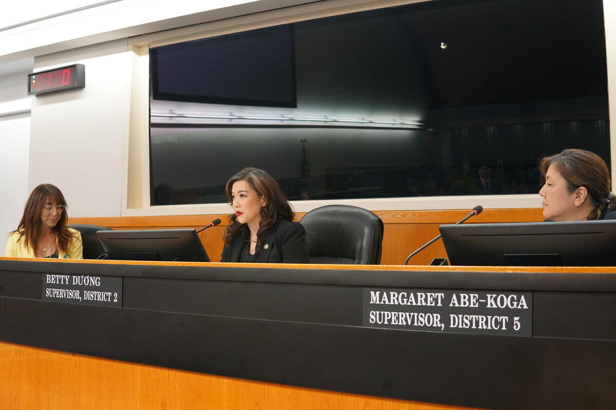 Supervisor Betty Duong speaking on the platform