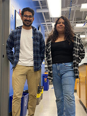 Izaiah Ornelas and Rithu Pattali wearing casual outgits in the lab