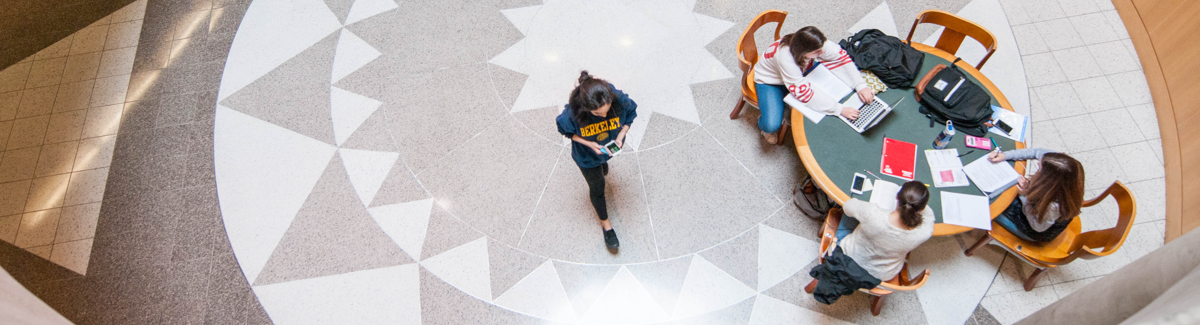 Overhead shot of student walking through library