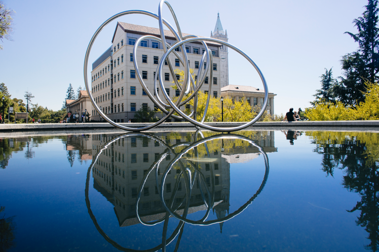 Fountain with metal rings sculpture