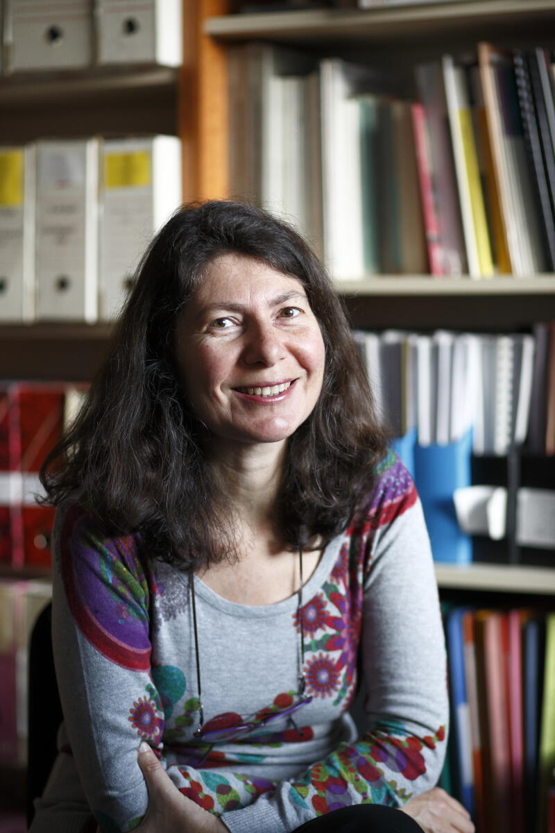 Photo of Magali Barbieri in sweater smiling at camera