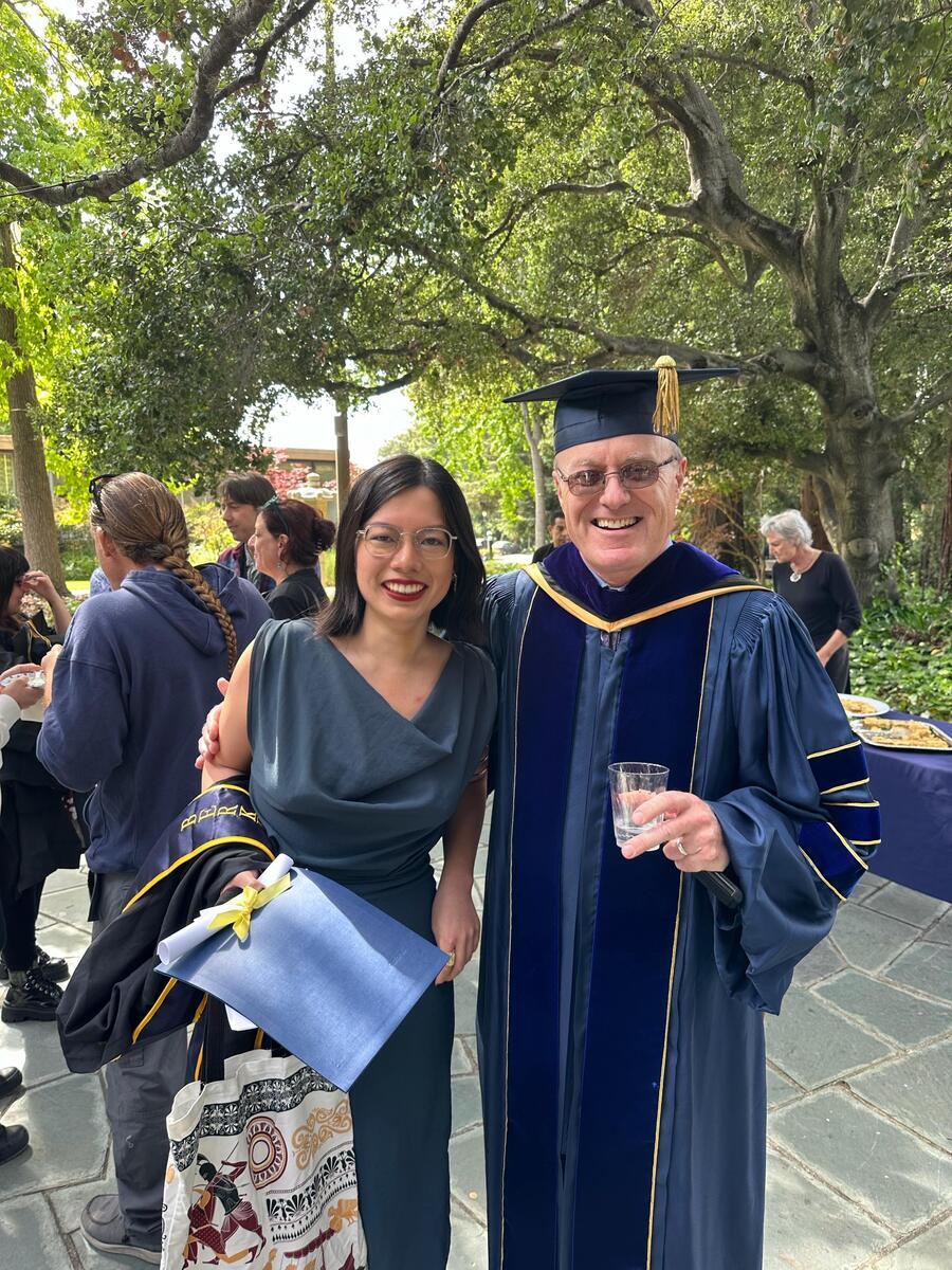 Roxana Wang with Prof. Trevor Murphy in regalia at commencement.