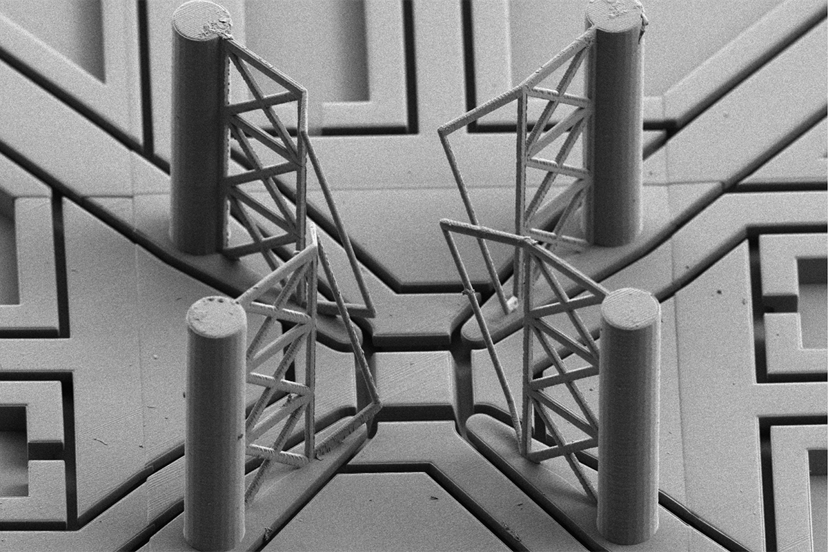 Four poles form a square with gates and lines running toward the center