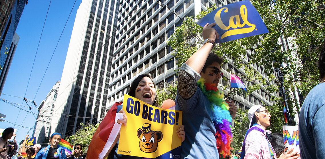 UC Berkeley community members march in SF Pride parade holding signs that say Go Bears and Cal