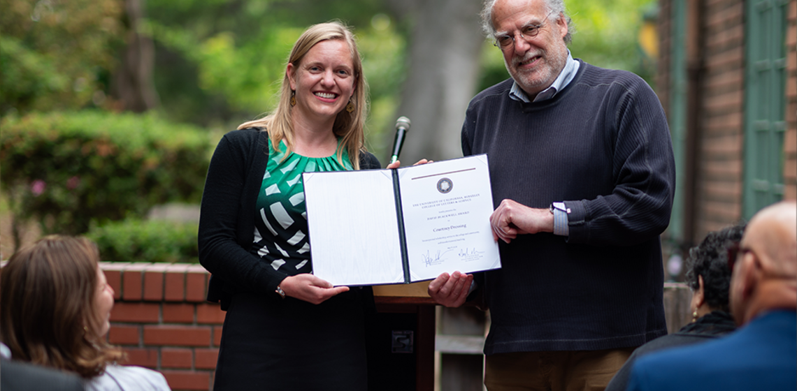 Man awards woman certificate