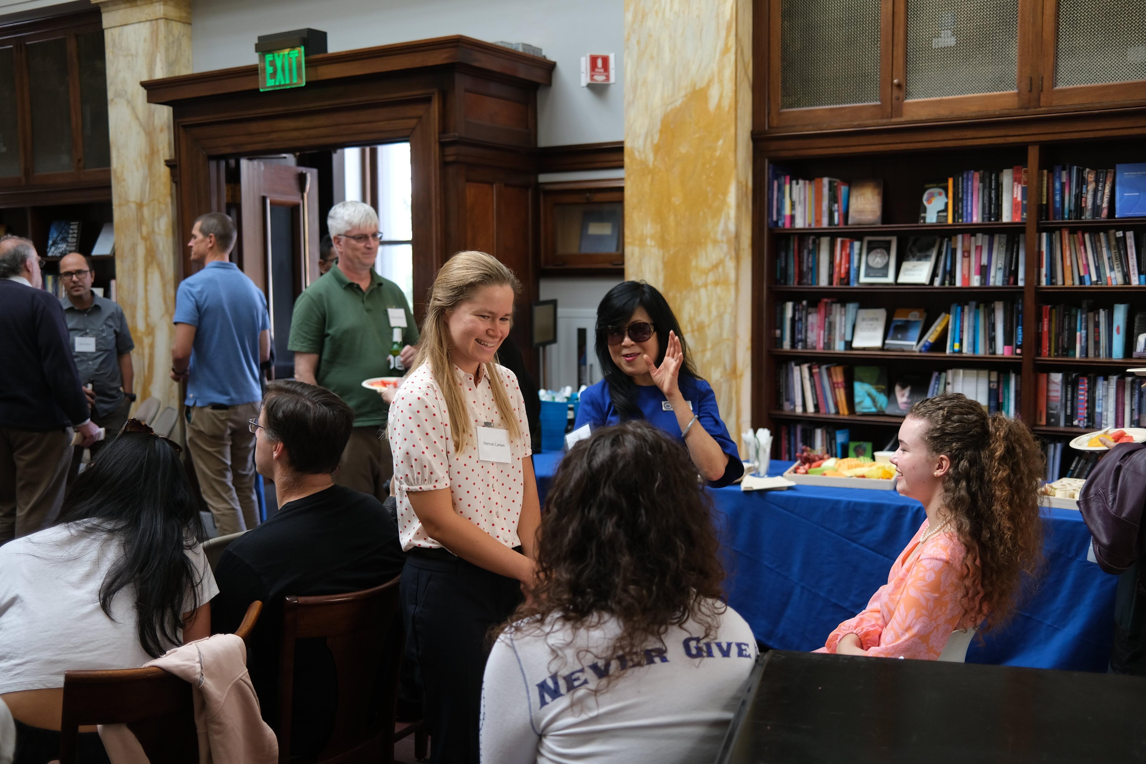 Hannah Larson (left) interacts with guests at Math on Tap.