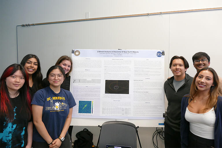 ULAB team holding a poster