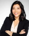 Headshot of Karen Huang, woman wearing dark suit with button down shirt and arms crossed
