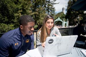 Two UC Berkeley students and a laptop