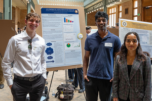 Students showing research at a poster session