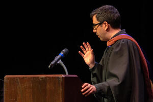Christopher Chen addresses TDPS graduates from the podium