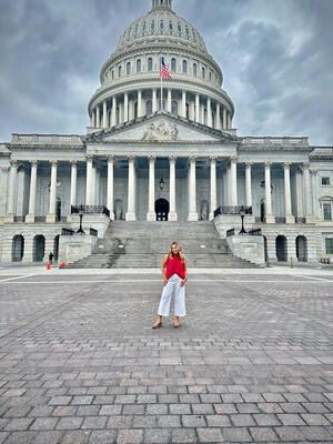 Woman stands in front of U.S. Capitol building